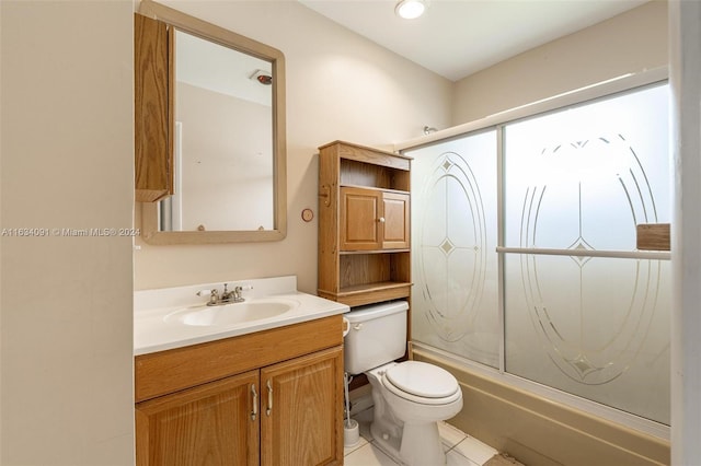 full bathroom with combined bath / shower with glass door, tile patterned floors, toilet, and vanity