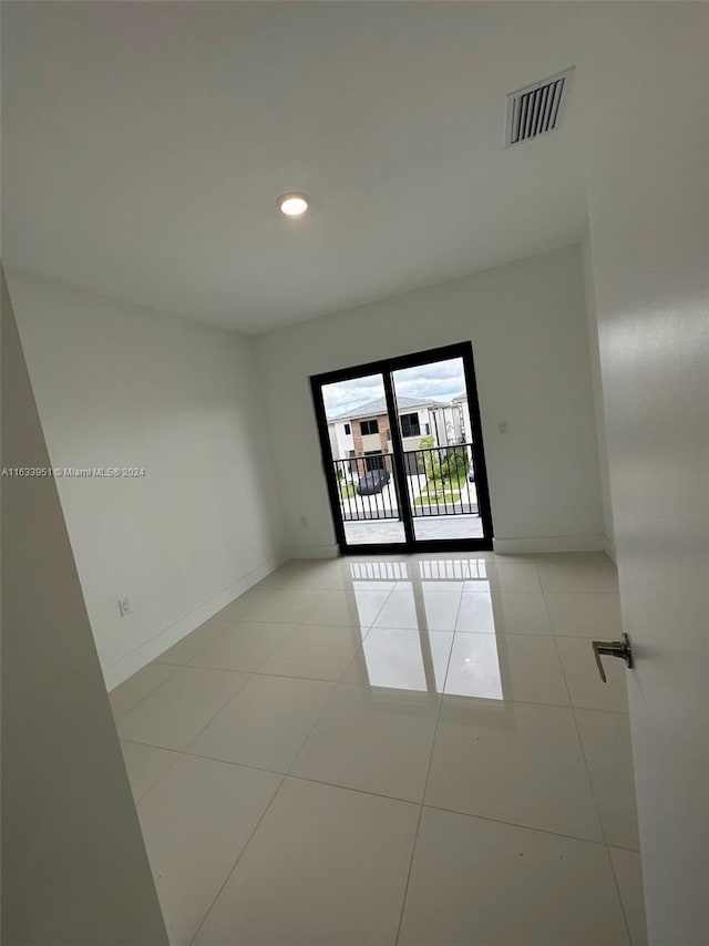 view of tiled spare room