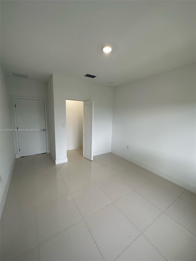 unfurnished bedroom featuring light tile patterned floors