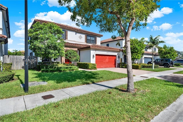 mediterranean / spanish-style house featuring a front lawn