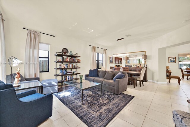 living room featuring a healthy amount of sunlight and light tile patterned floors