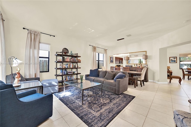 living room with a wealth of natural light and light tile patterned floors