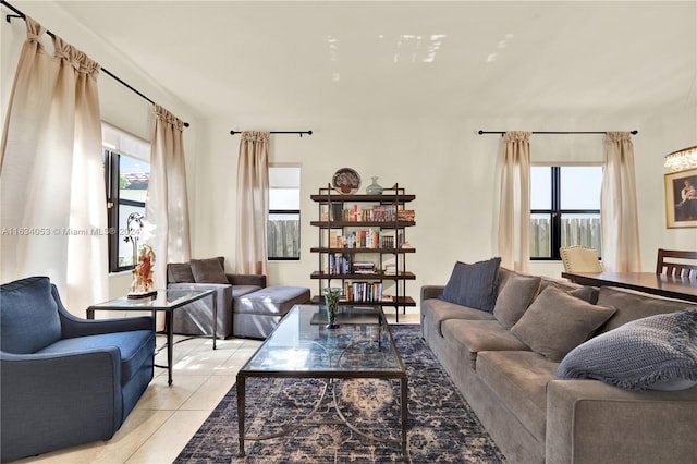 living room with light tile patterned flooring and a wealth of natural light