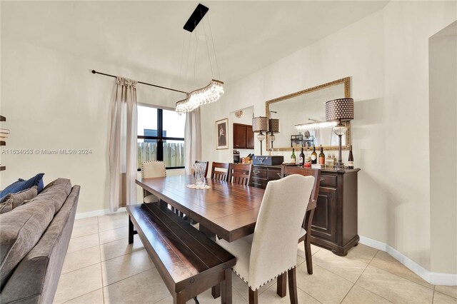 dining space featuring light tile patterned floors