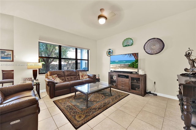 tiled living room featuring ceiling fan