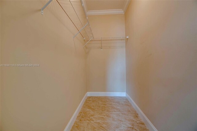 spacious closet with light tile patterned floors