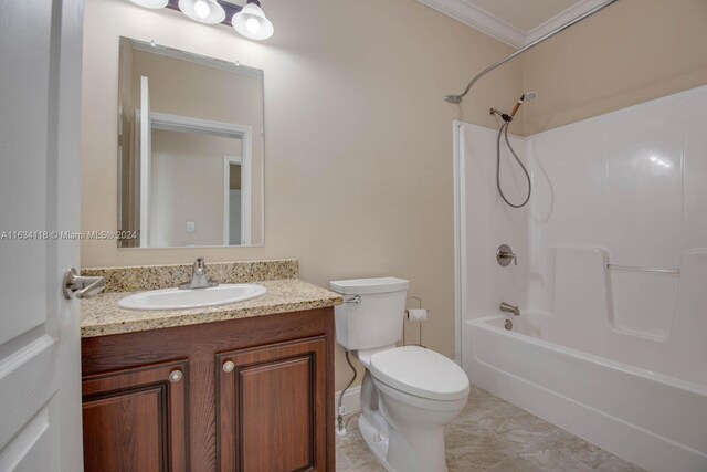 full bathroom featuring tile patterned flooring, crown molding, shower / tub combination, toilet, and vanity