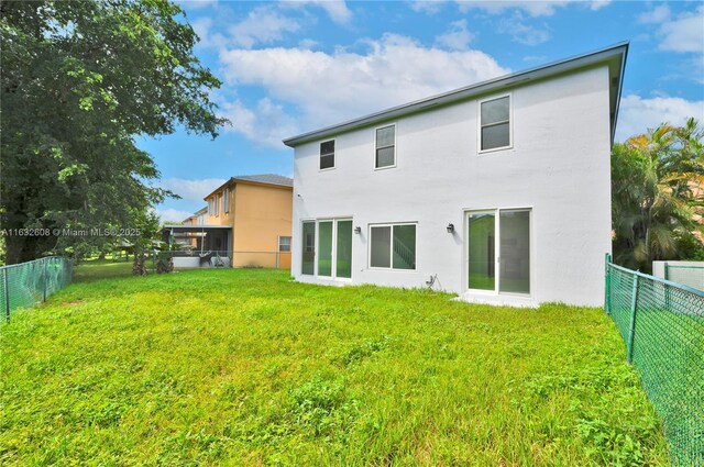 garage with a garage door opener, electric panel, ceiling fan, separate washer and dryer, and water heater