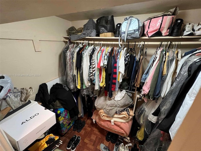 spacious closet with parquet floors