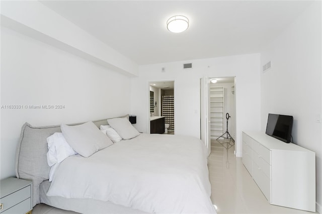 bedroom featuring light tile patterned flooring