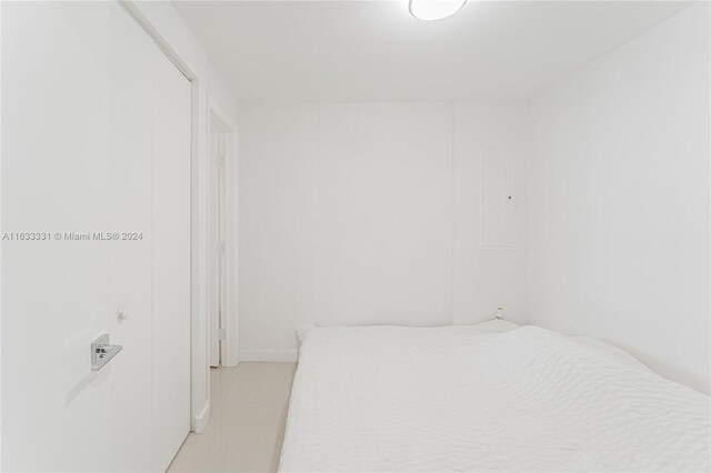 bedroom featuring light tile patterned floors