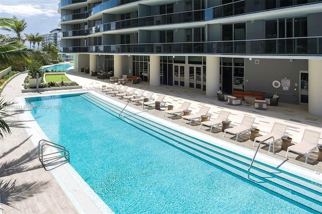 view of pool featuring a patio