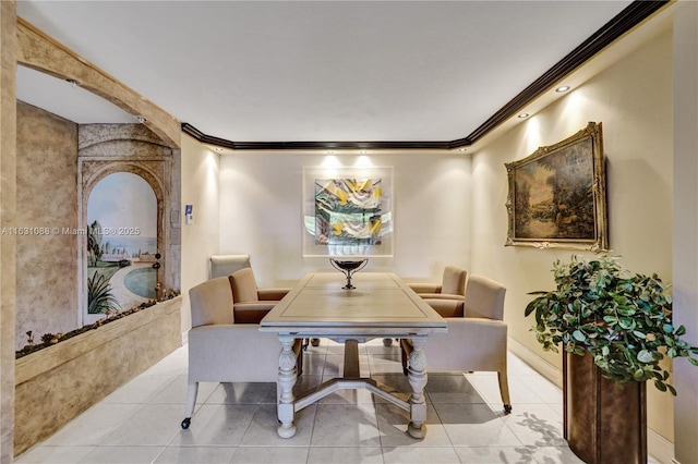 tiled dining area featuring ornamental molding