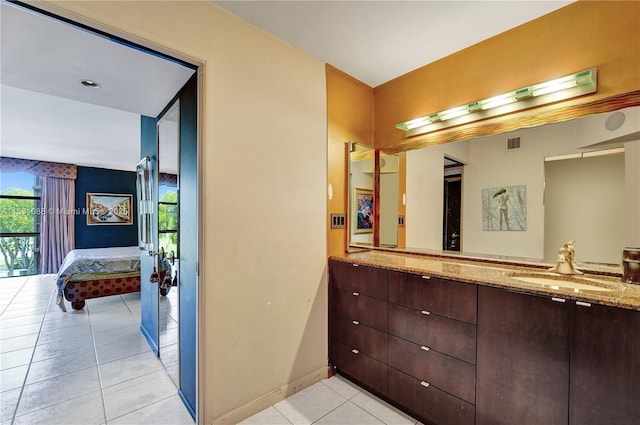 bathroom with vanity and tile patterned floors