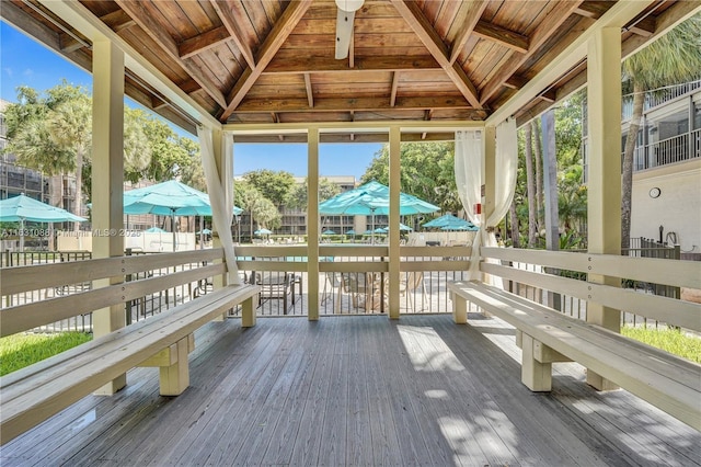 sunroom / solarium with wood ceiling and lofted ceiling with beams