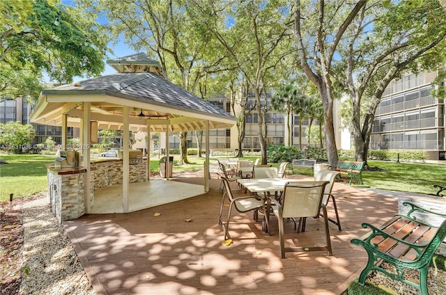 view of patio / terrace with a wooden deck, a gazebo, and exterior bar