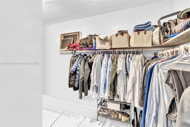 spacious closet with tile patterned flooring