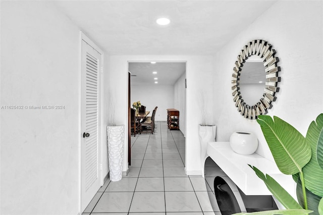 hallway with light tile patterned floors