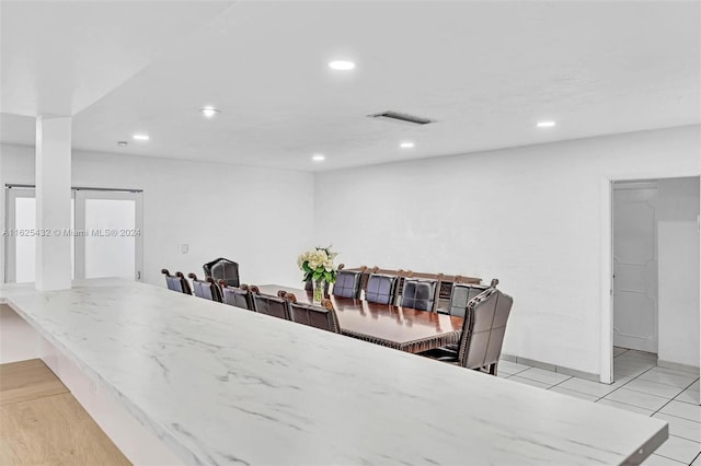 dining space with light tile patterned floors