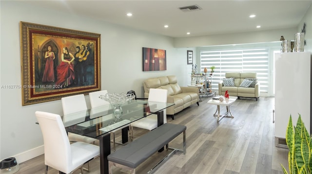 dining room featuring light hardwood / wood-style floors