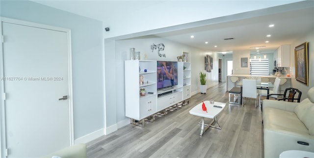 living room with light hardwood / wood-style floors