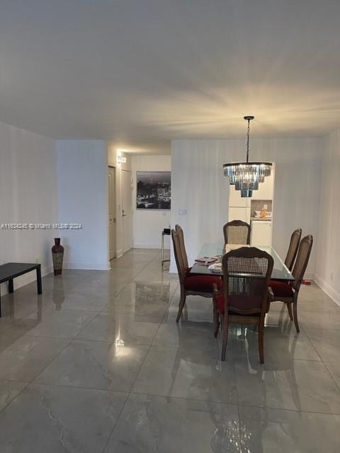 2401 S Ocean Dr Unit 1203, Hollywood, FL 33019 - dining area with an inviting chandelier