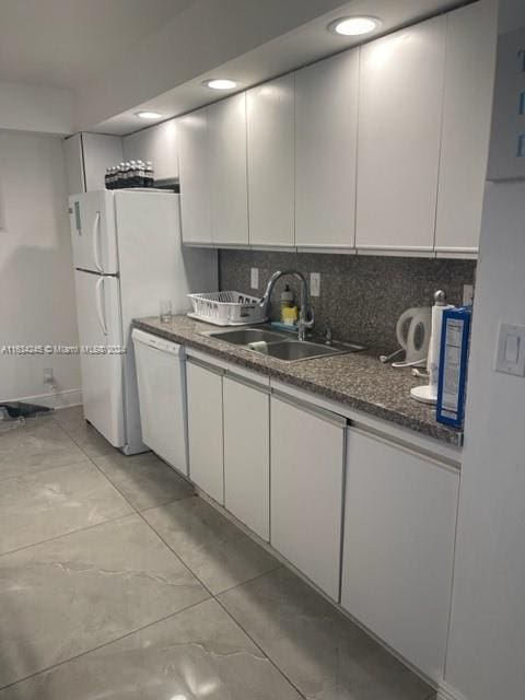 2401 S Ocean Dr Unit 1203, Hollywood, FL 33019 - kitchen featuring dishwasher, sink, decorative backsplash, and white cabinets