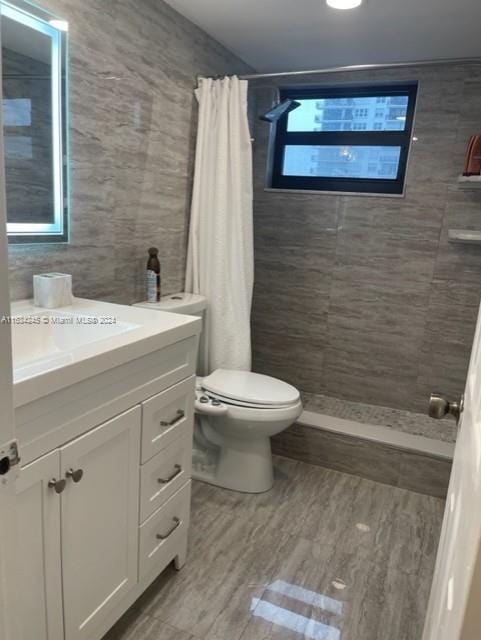 2401 S Ocean Dr Unit 1203, Hollywood, FL 33019 - bathroom with vanity, wood-type flooring, curtained shower, and toilet