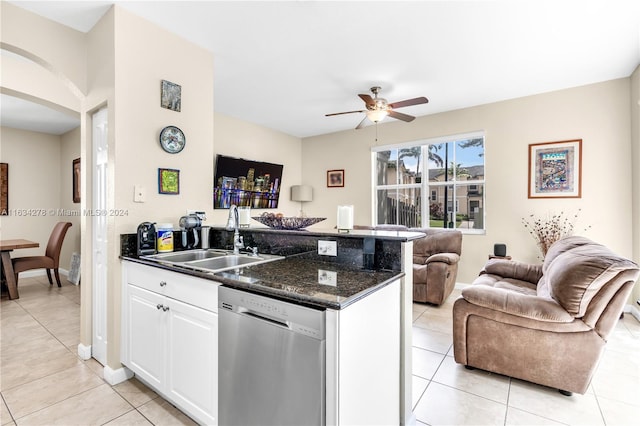 kitchen featuring dishwasher, light tile patterned floors, white cabinetry, and sink