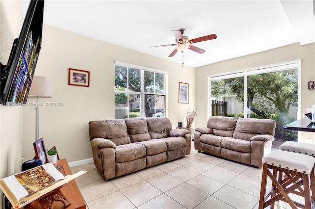 tiled living room with ceiling fan