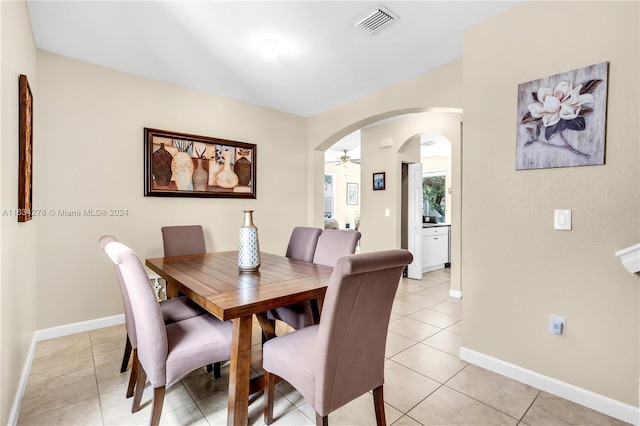 tiled dining room with ceiling fan