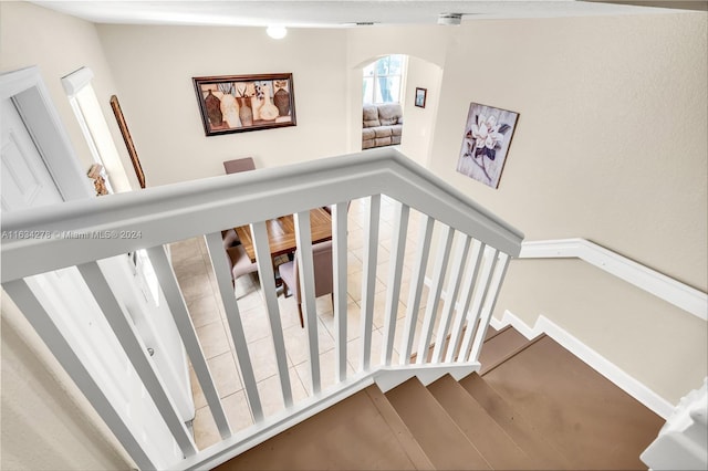 staircase with wood-type flooring