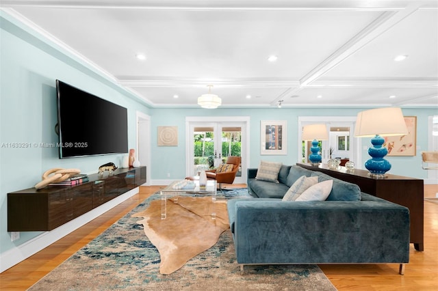 living room featuring beam ceiling, light hardwood / wood-style floors, and coffered ceiling