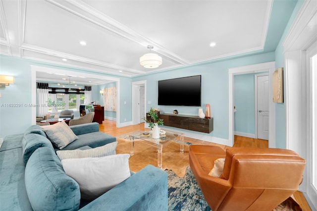 living area featuring baseboards, crown molding, light wood finished floors, and recessed lighting
