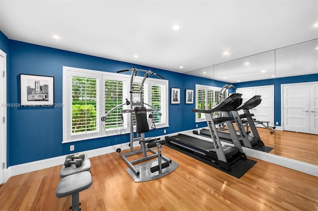workout room with wood finished floors, baseboards, and recessed lighting