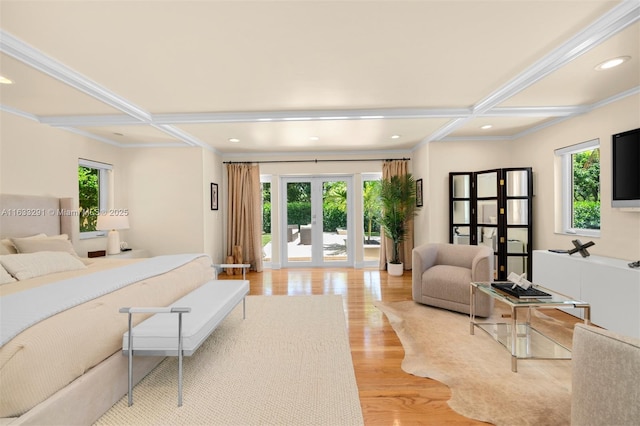 bedroom featuring coffered ceiling, french doors, and light wood-type flooring