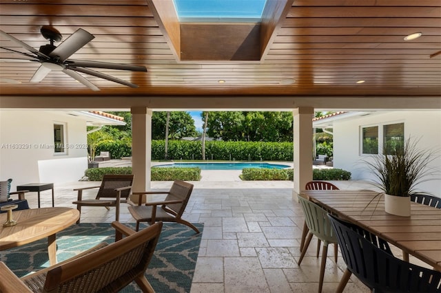 sunroom featuring a skylight