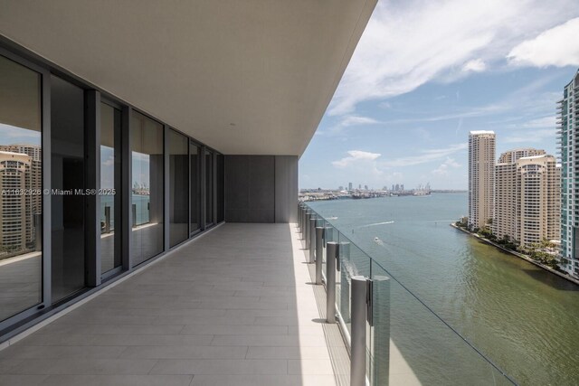 balcony featuring a water view