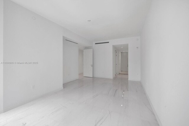 unfurnished room featuring light tile patterned flooring