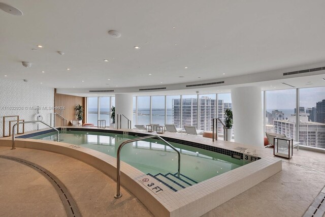 view of pool with a jacuzzi