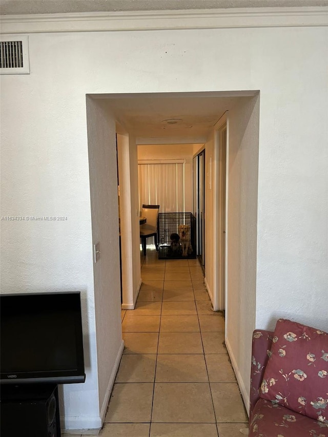 hallway featuring tile patterned floors