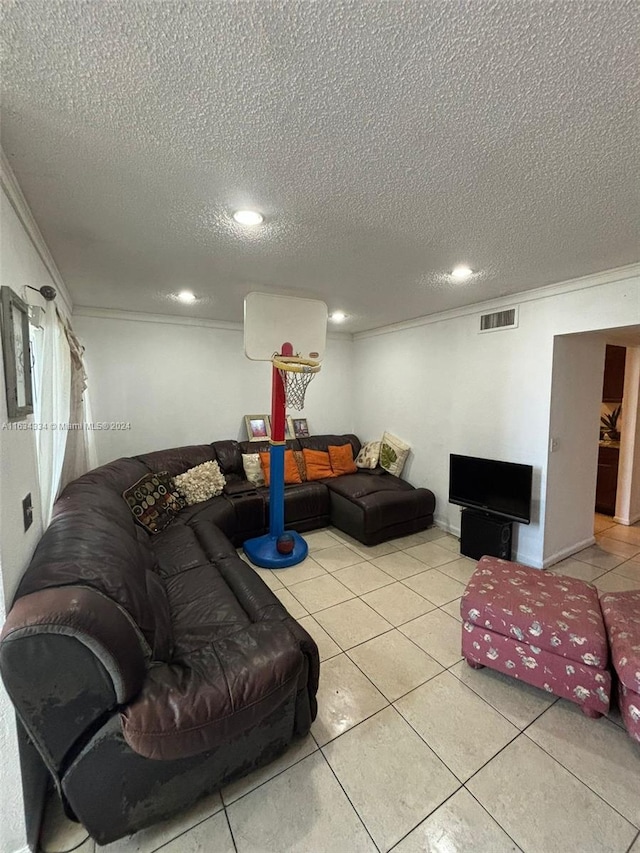 living room with light tile patterned floors and a textured ceiling