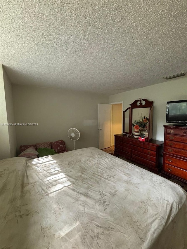 bedroom featuring a textured ceiling