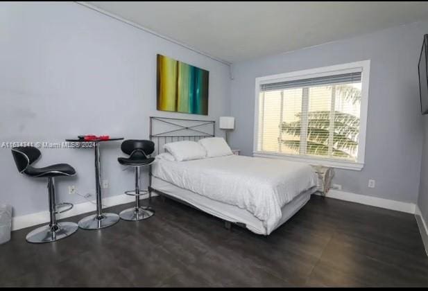 bedroom featuring hardwood / wood-style flooring