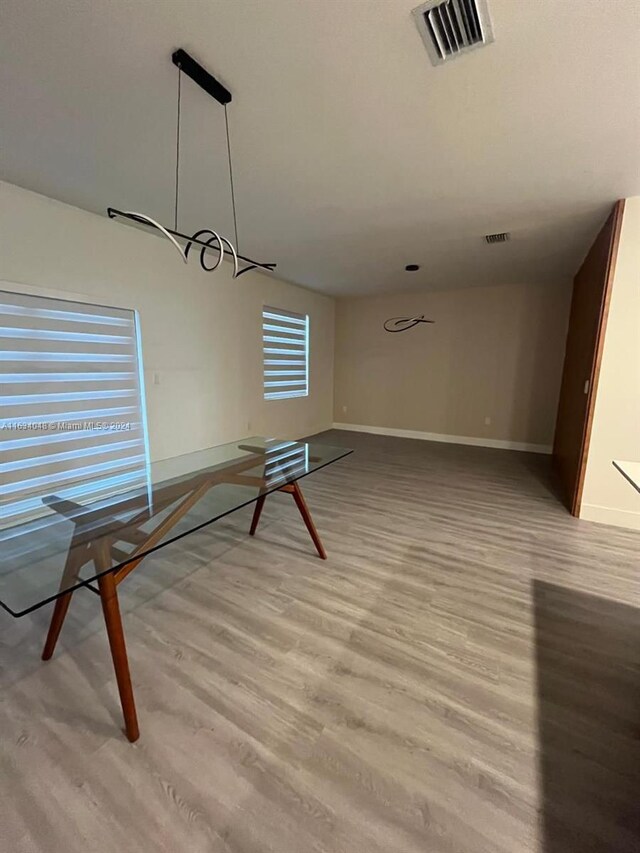 unfurnished dining area featuring light hardwood / wood-style flooring