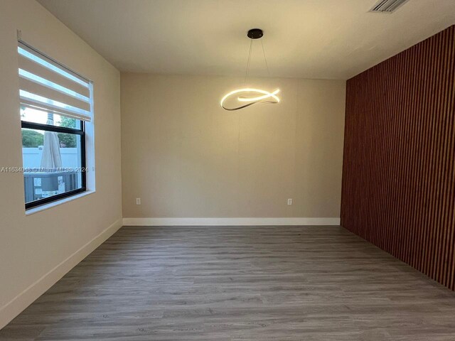 empty room featuring hardwood / wood-style floors