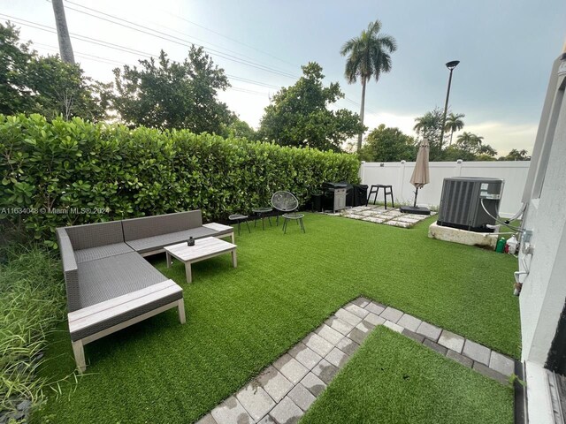 view of yard with a patio and cooling unit