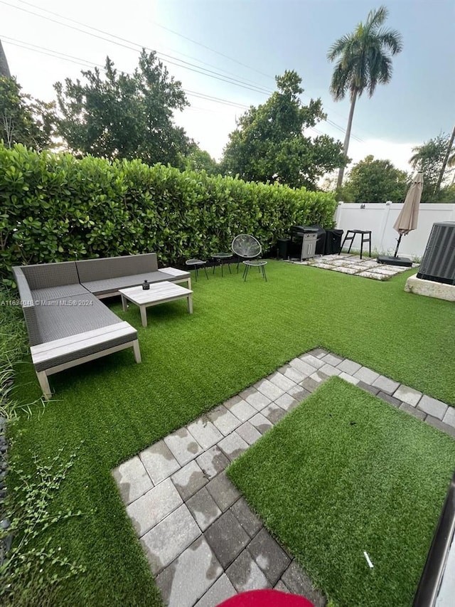 view of yard with a patio area and an outdoor fire pit