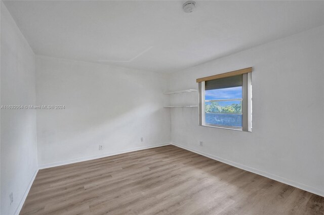 empty room featuring hardwood / wood-style flooring