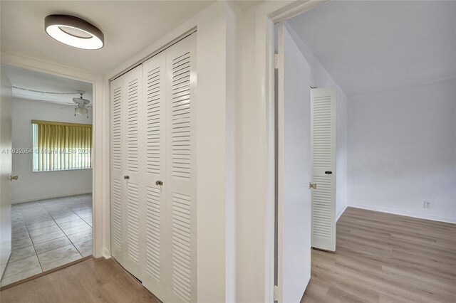 corridor with light hardwood / wood-style flooring